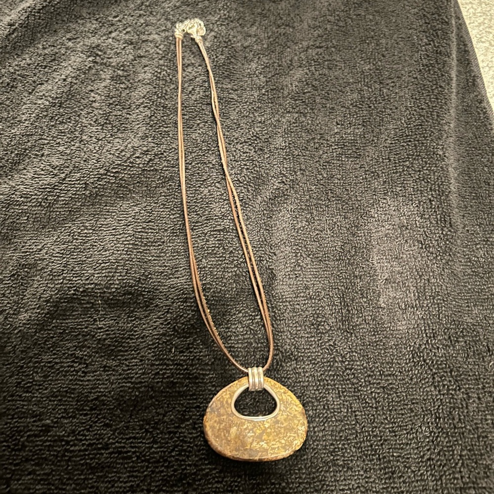 Brown stone pendant on leather strap